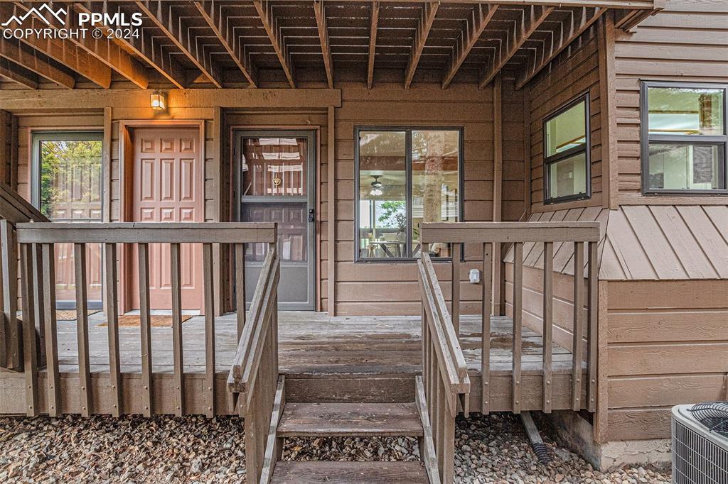 a view of a porch with wooden floor