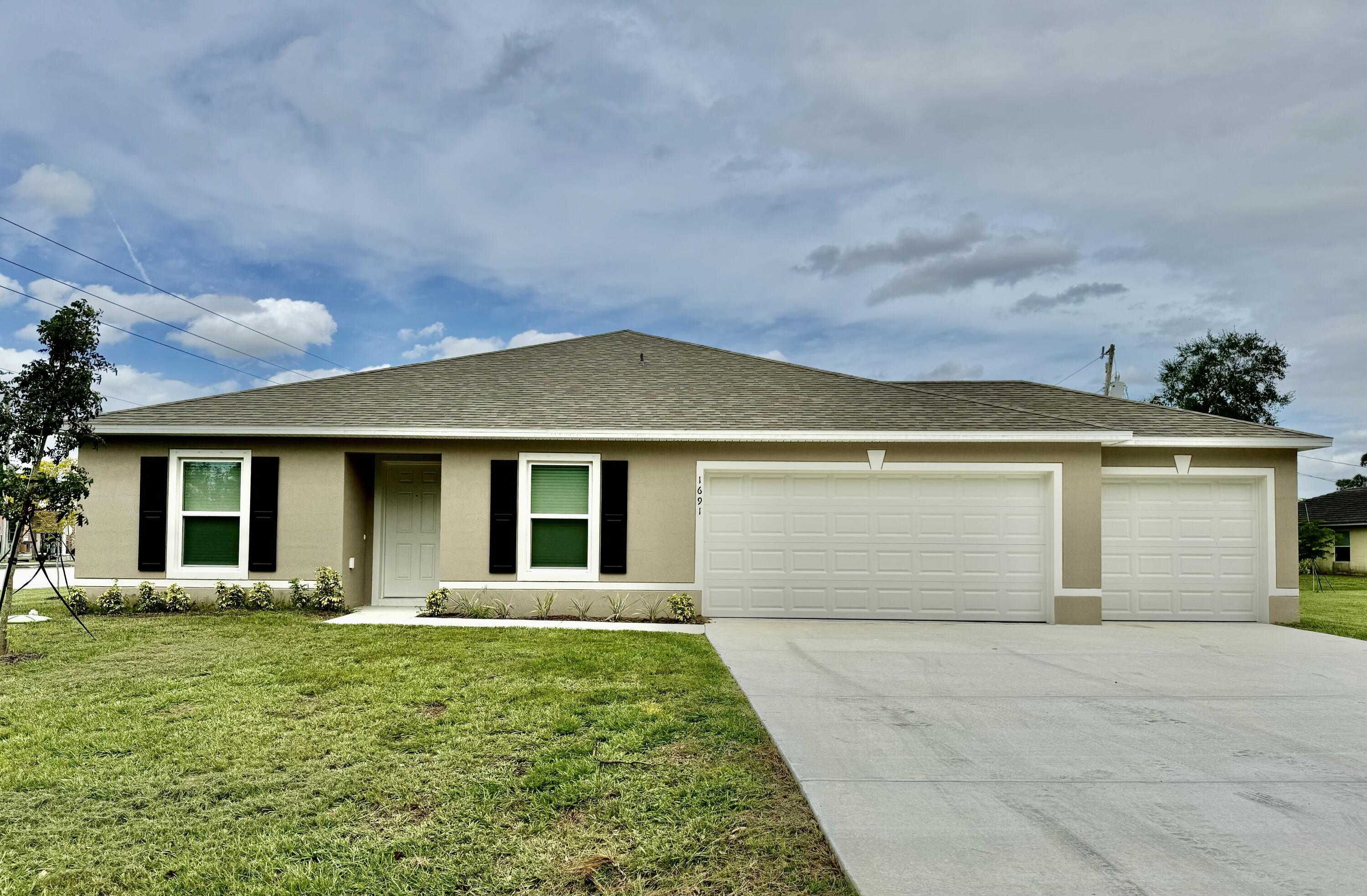 front view of a house with a yard