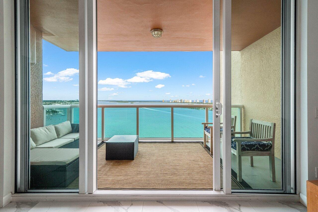 a view of a living room and a floor to ceiling window