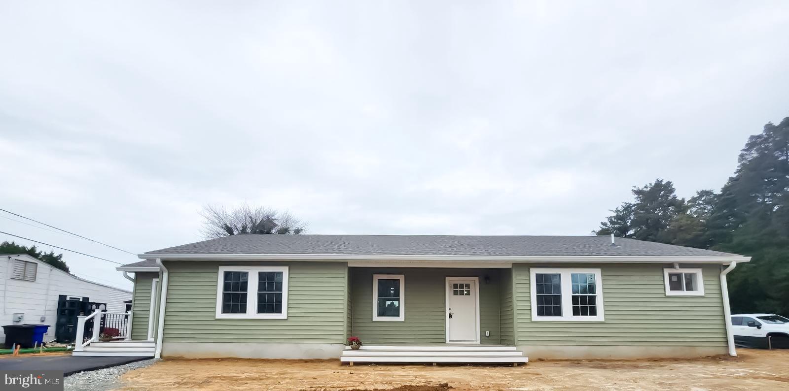 a front view of a house with a pathway