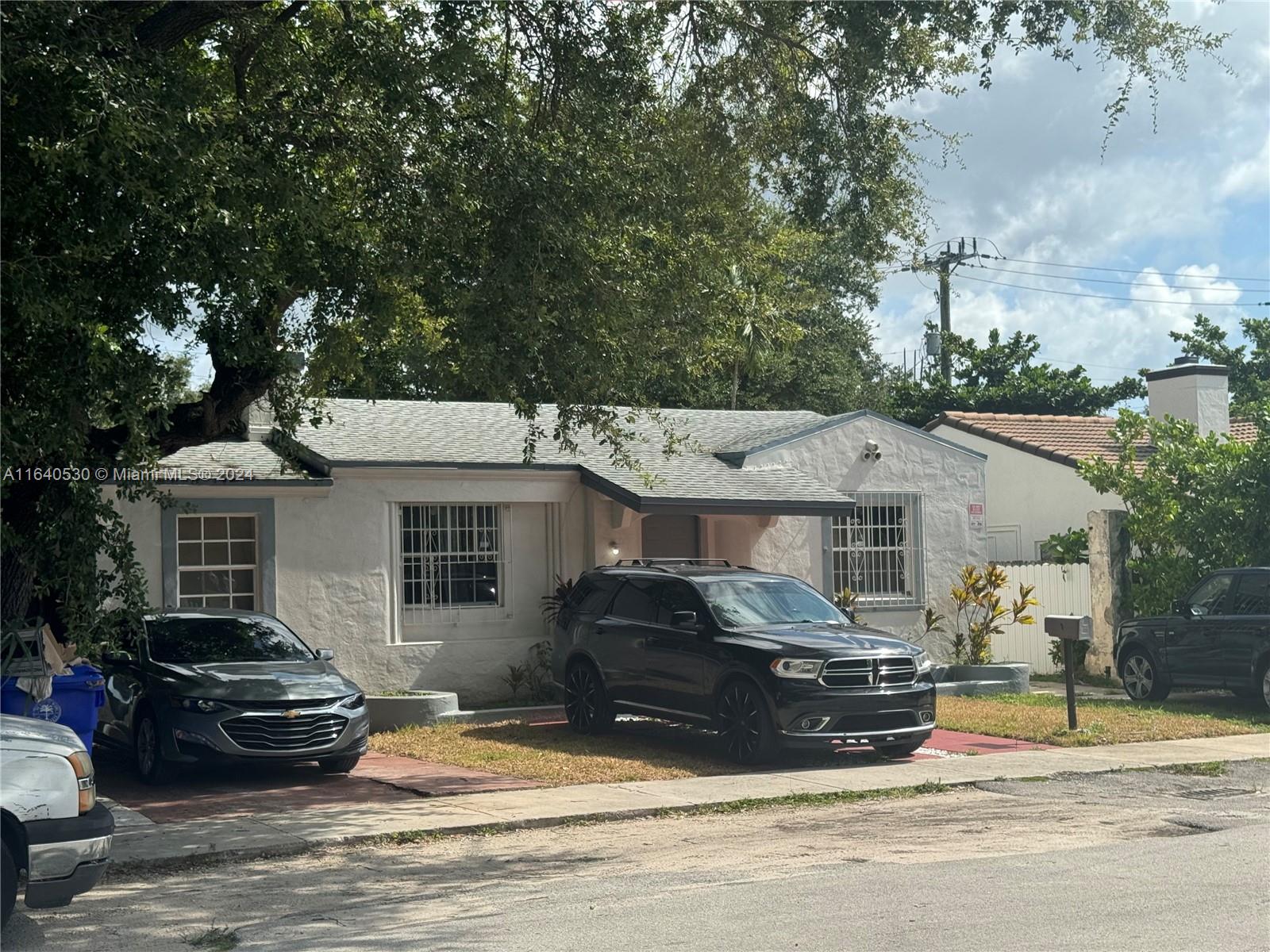 a view of a car parked front of house