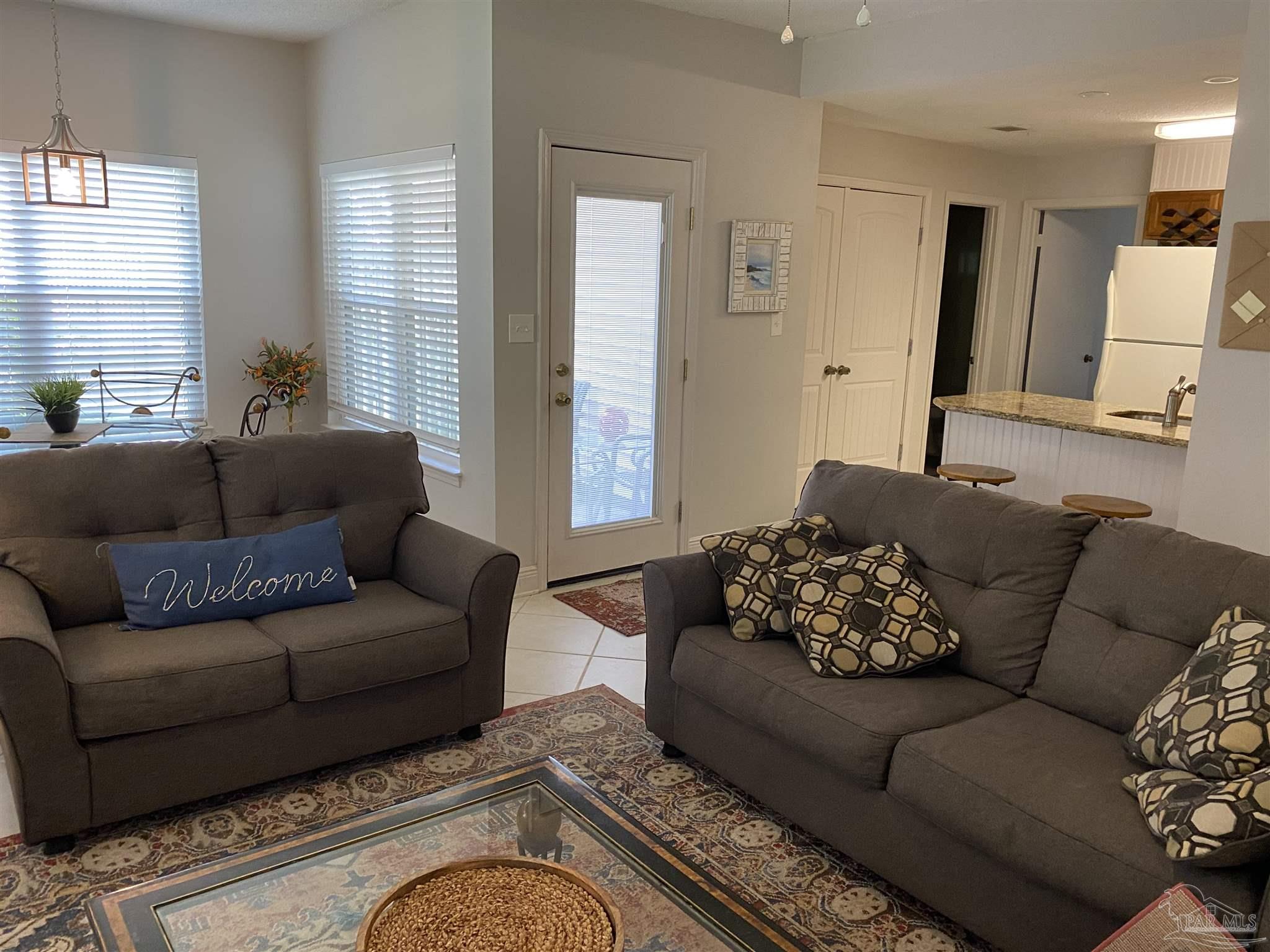 a living room with furniture or couch and a window