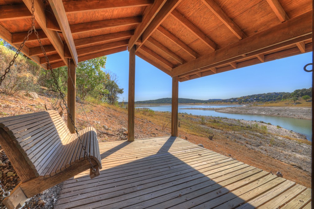 a view of a balcony with wooden floor