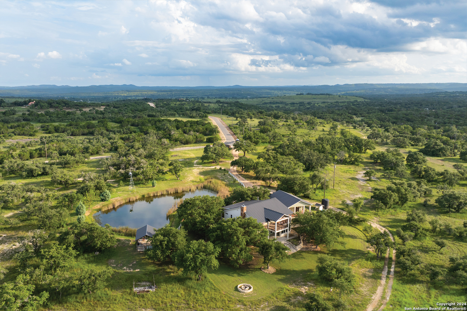 an aerial view of residential houses with outdoor space