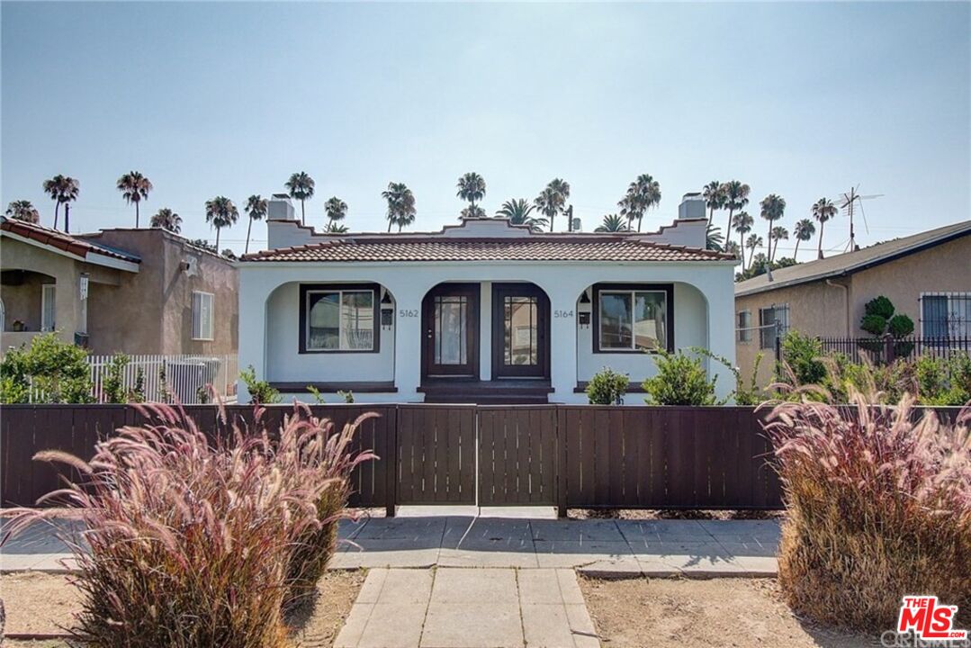 a front view of a house with yard