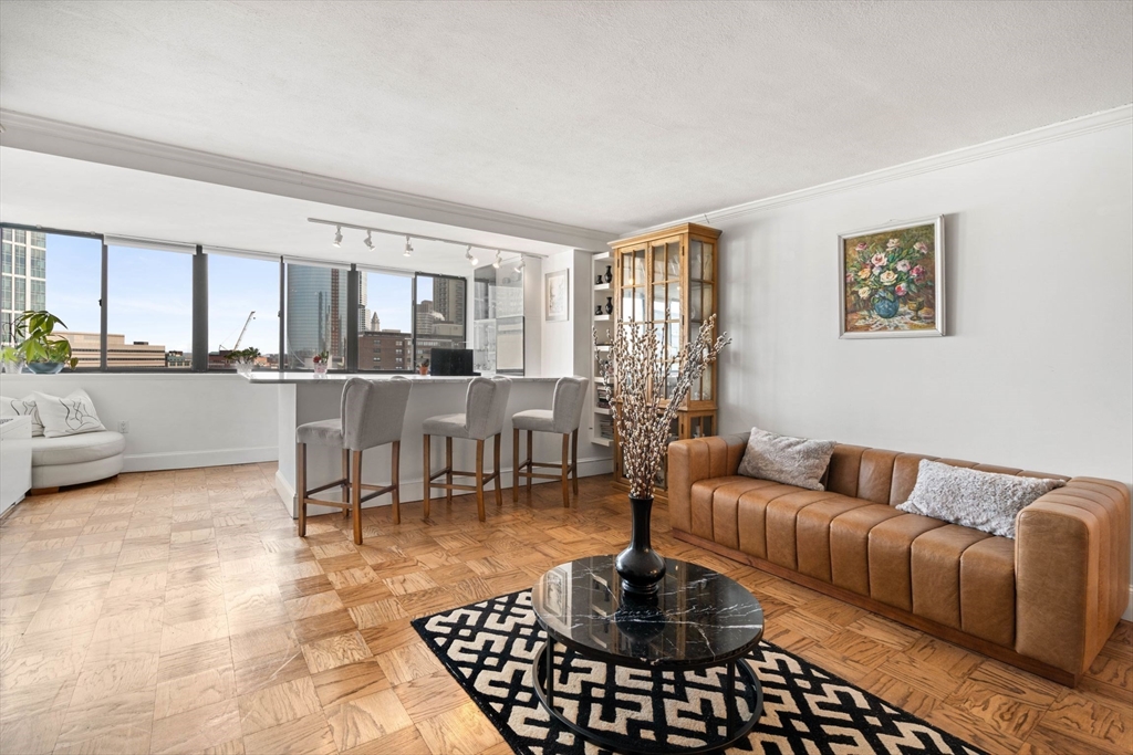 a living room with furniture and a rug