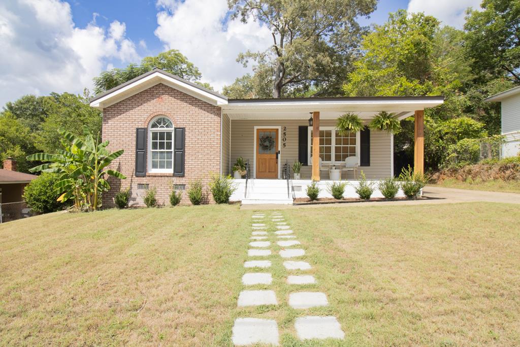 a front view of a house with a yard