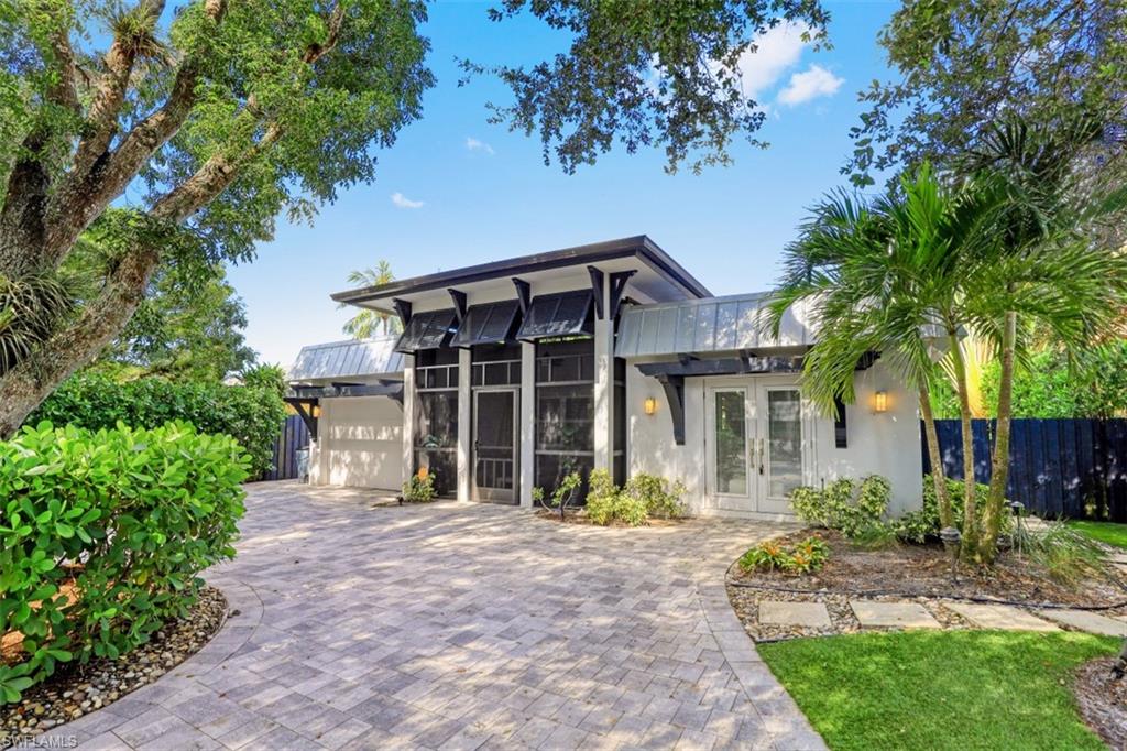 front view of a house with a garden