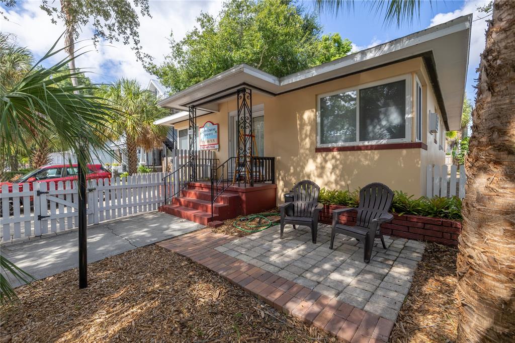 a view of house with outdoor seating space