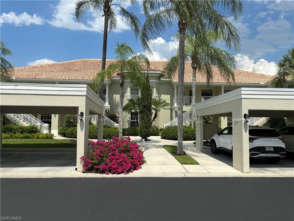 View of front facade with a carport