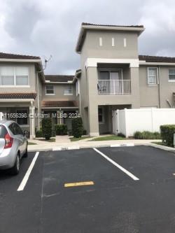 a front view of a house with yard