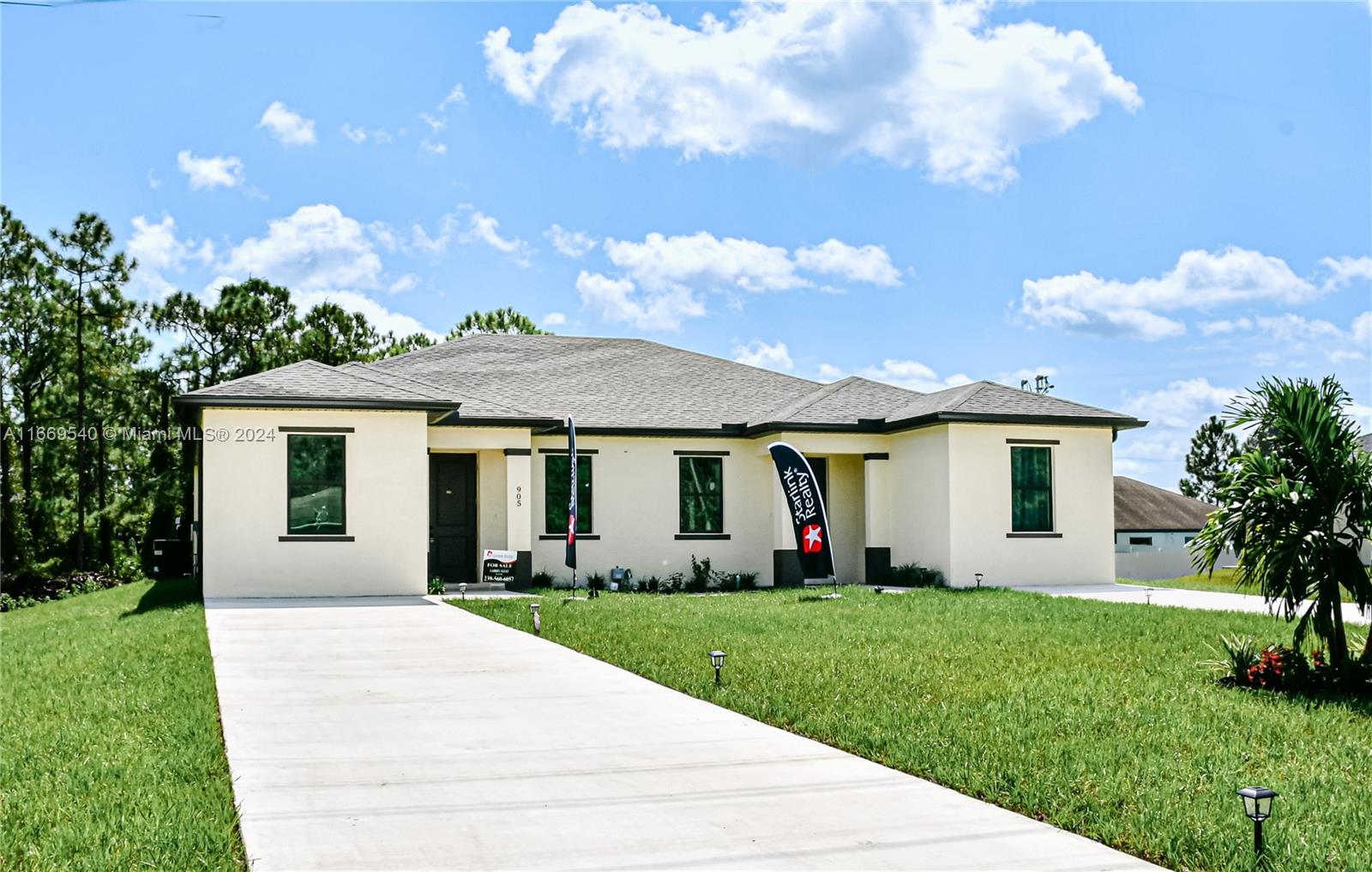 a front view of house with yard and green space