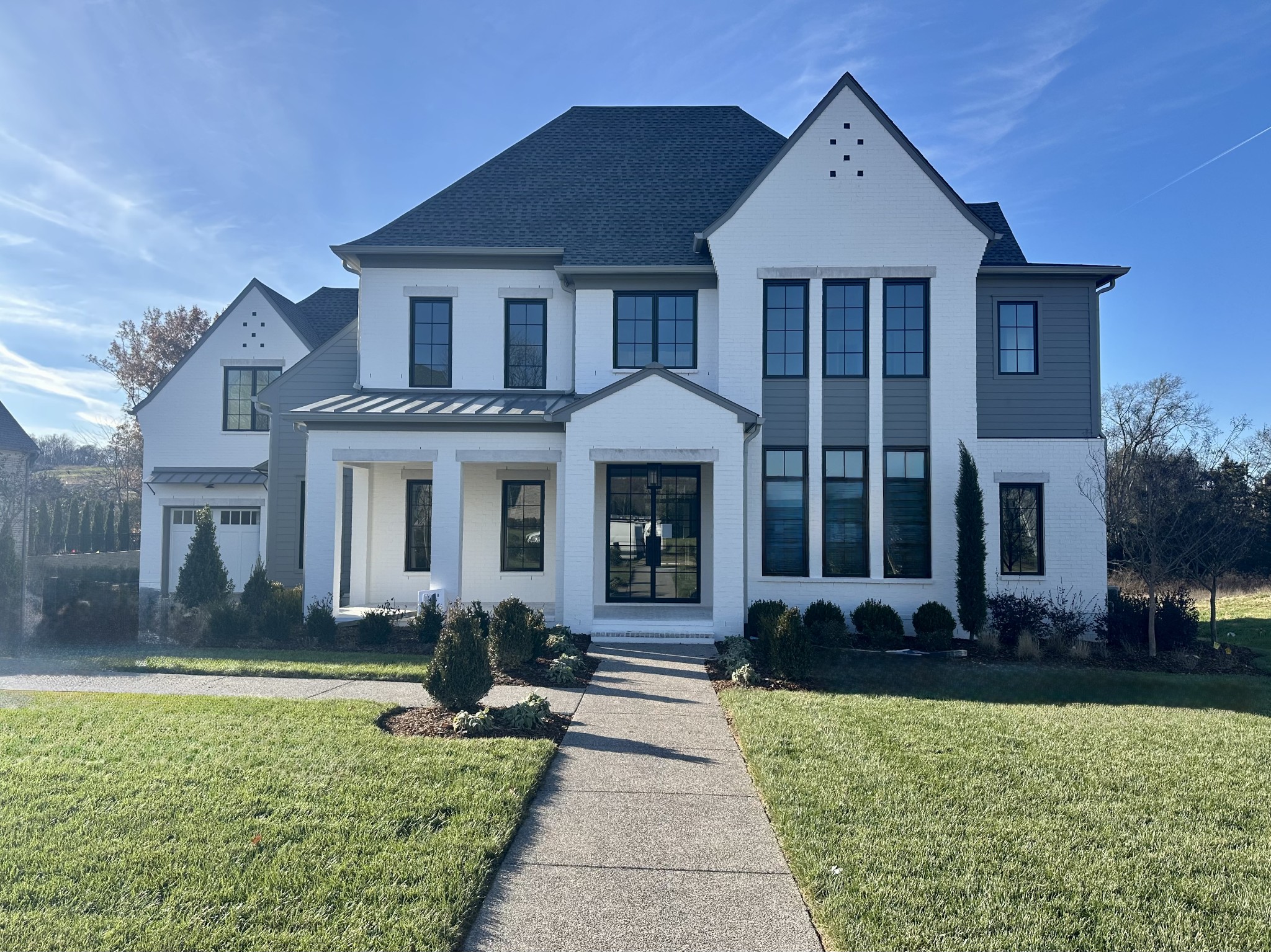 a front view of a house with a yard