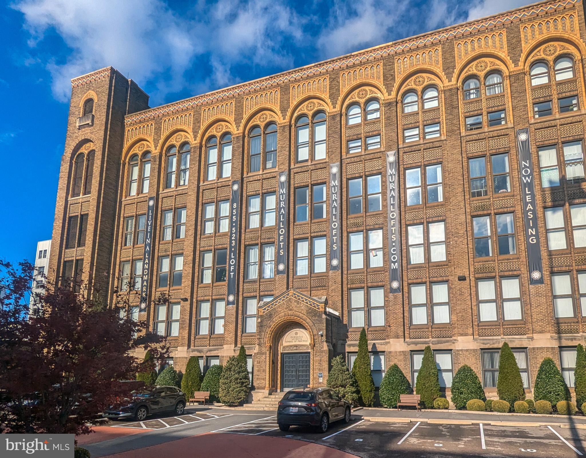 a front view of a building with garden