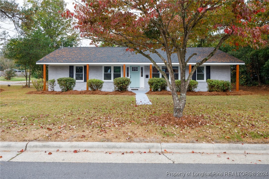 front view of a house with a yard