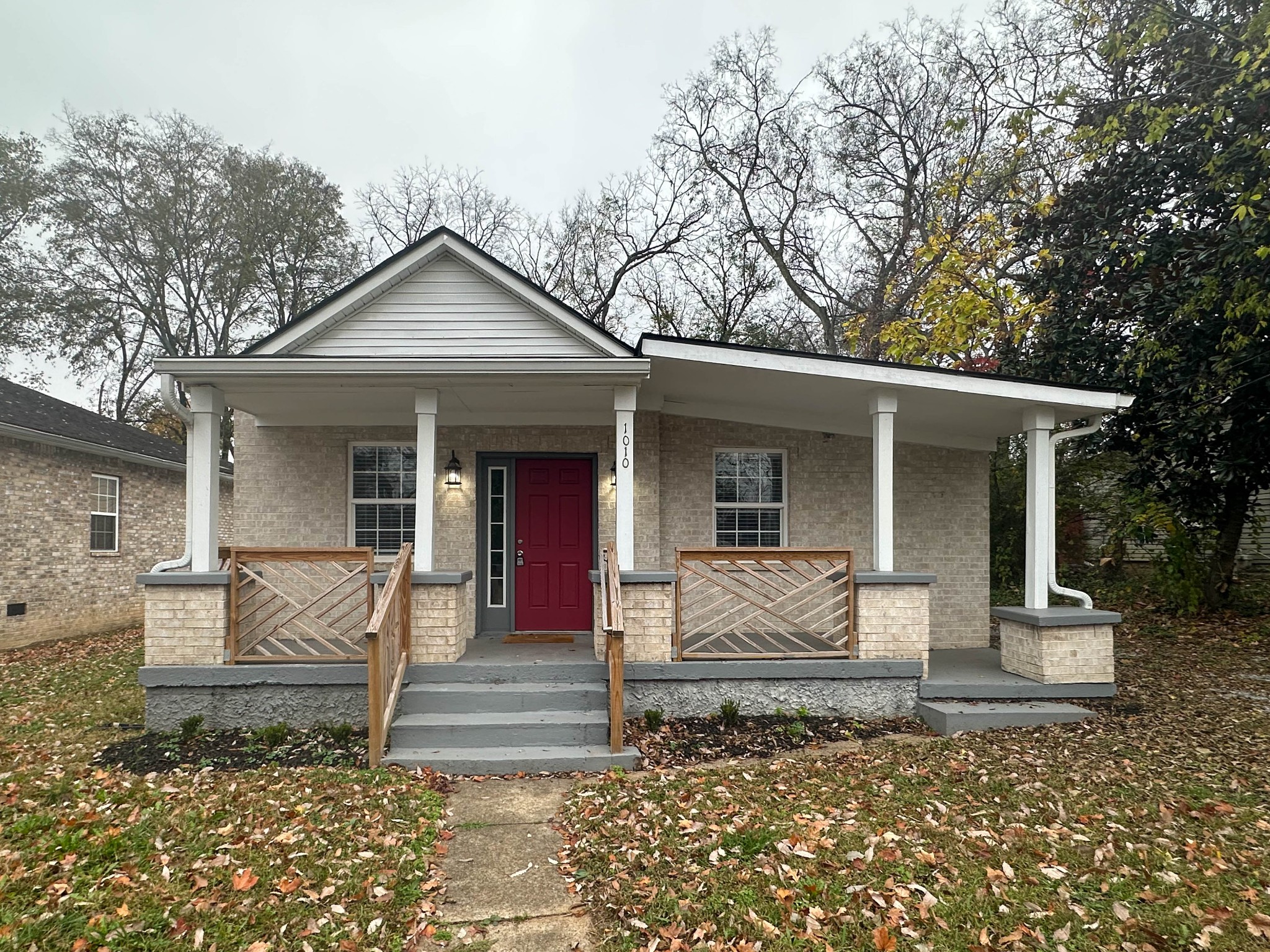 a front view of a house with a porch