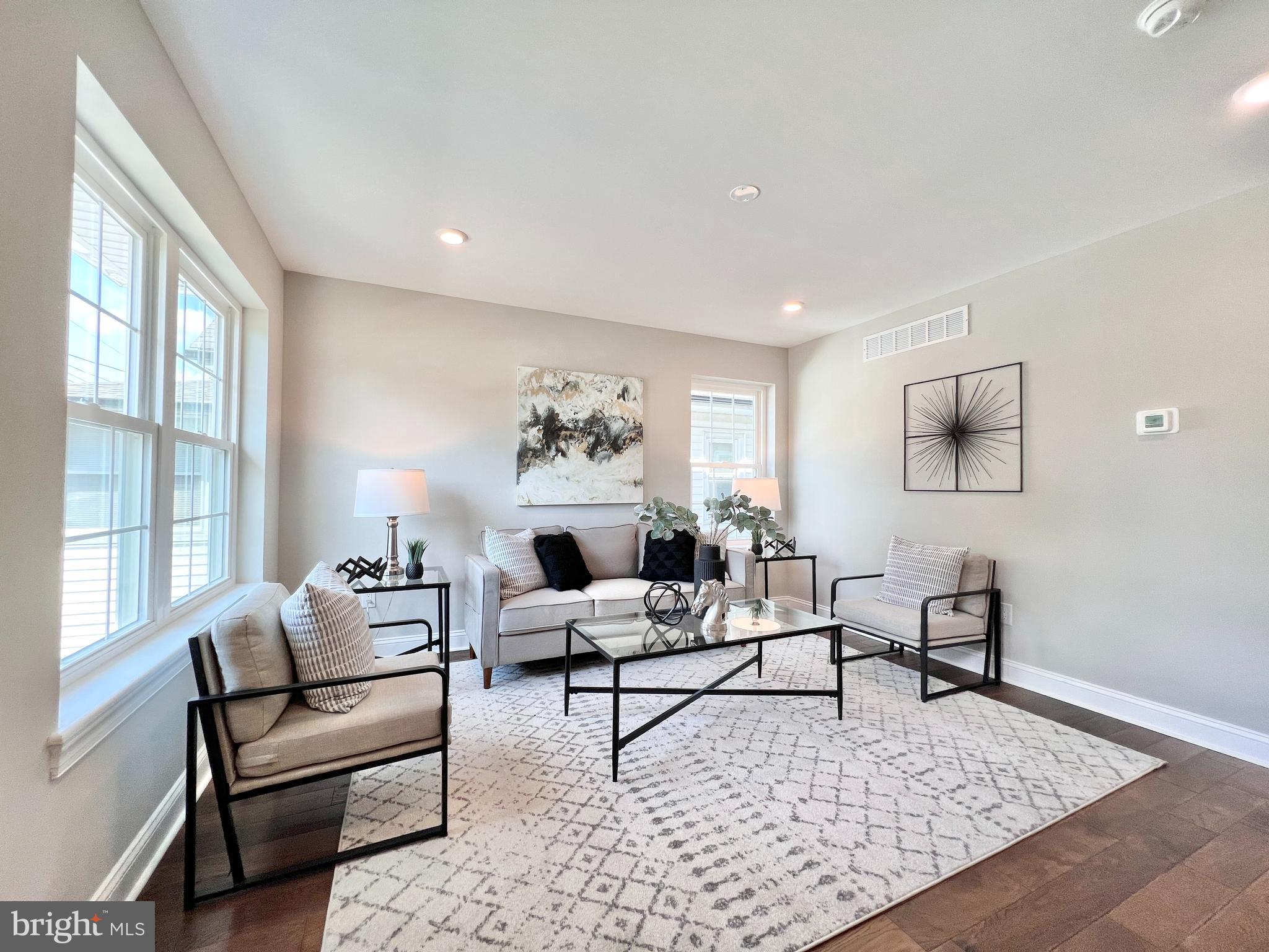 a living room with furniture and a rug