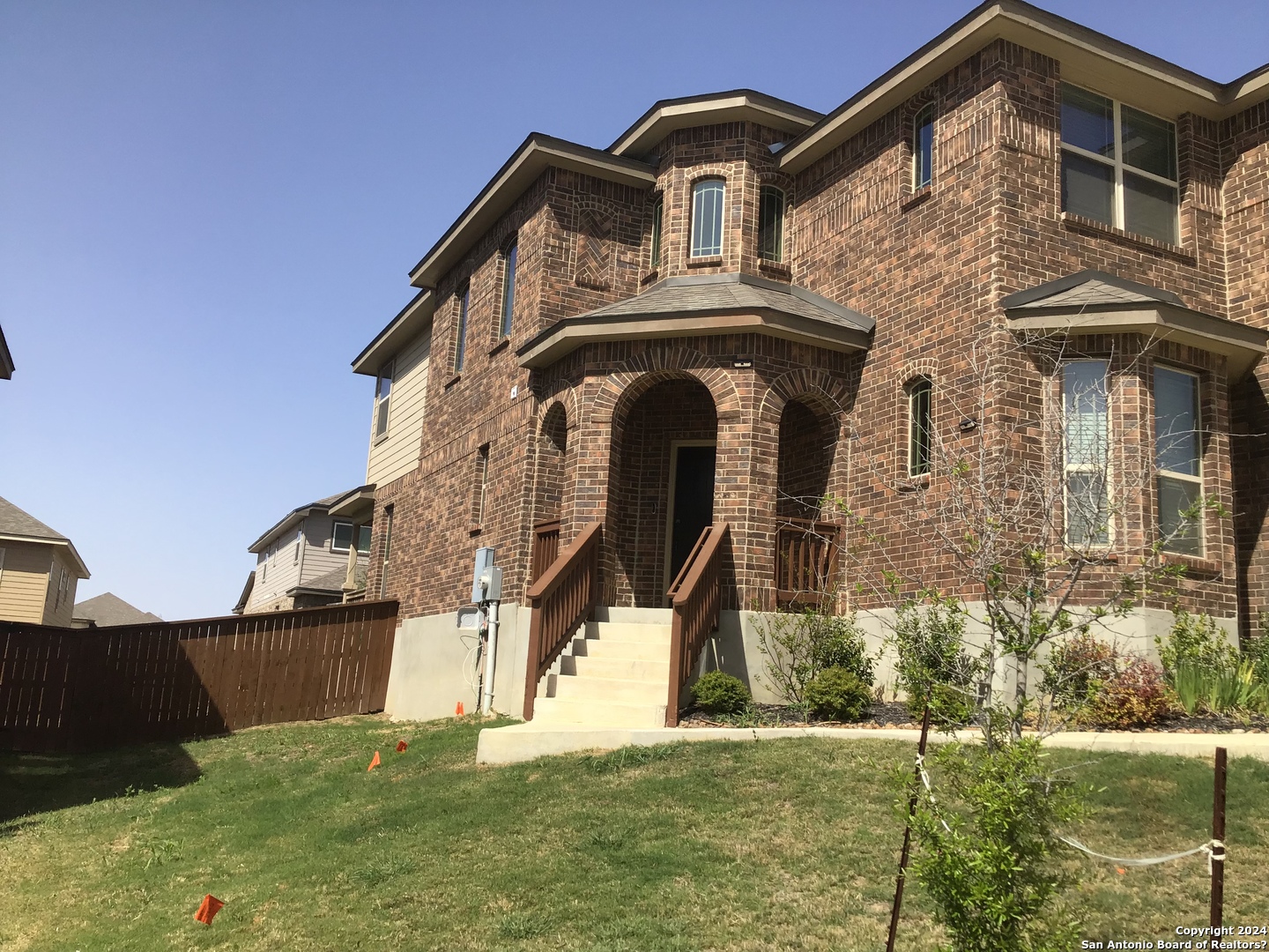 a front view of a house with a yard