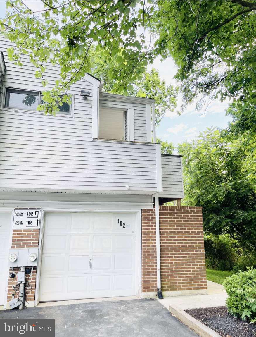 a front view of a house with a garage