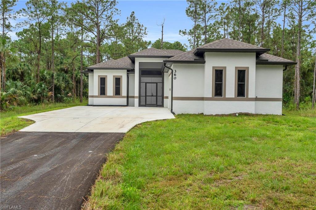 Prairie-style home featuring a front yard