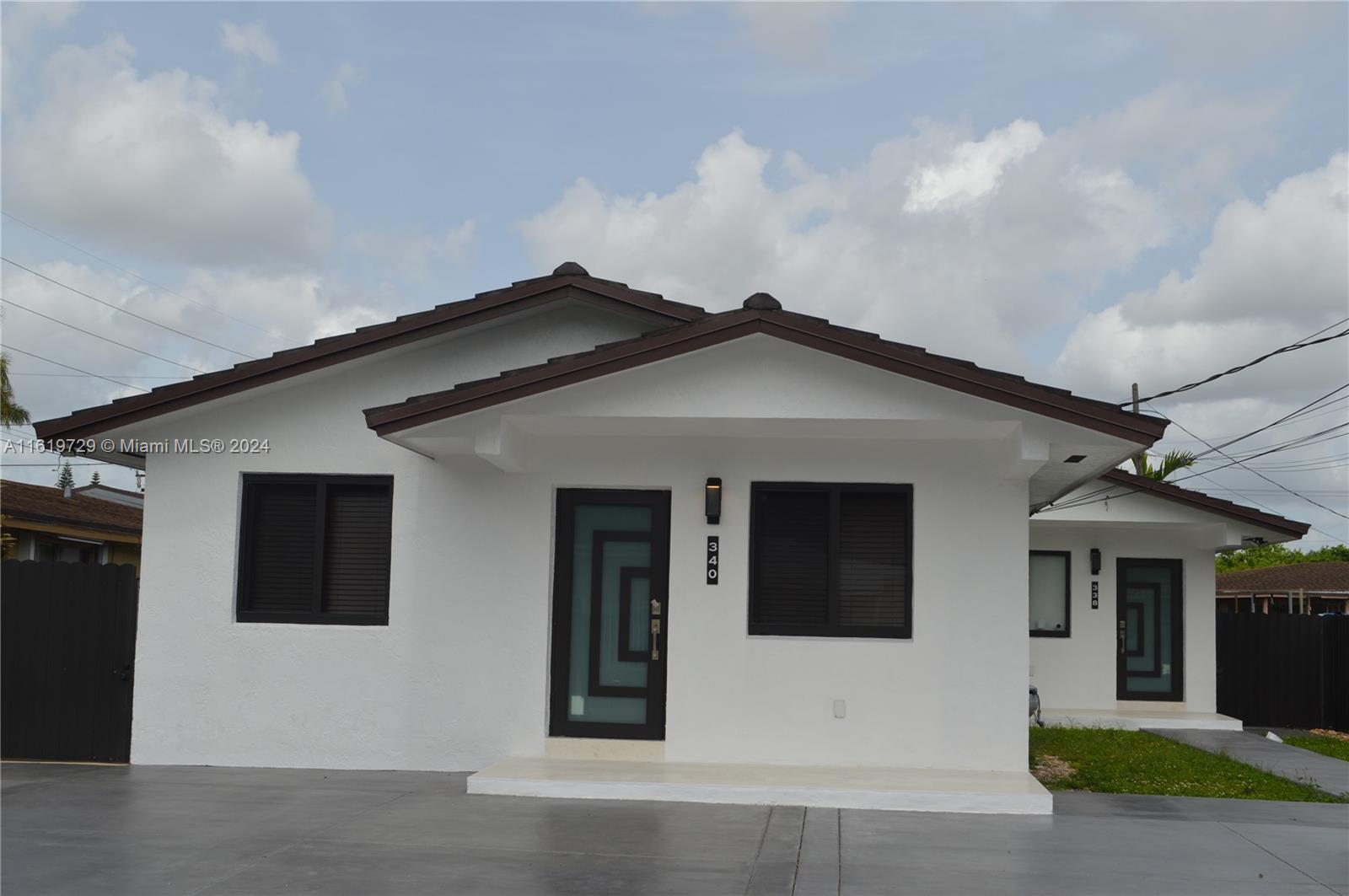 a front view of a house with garage