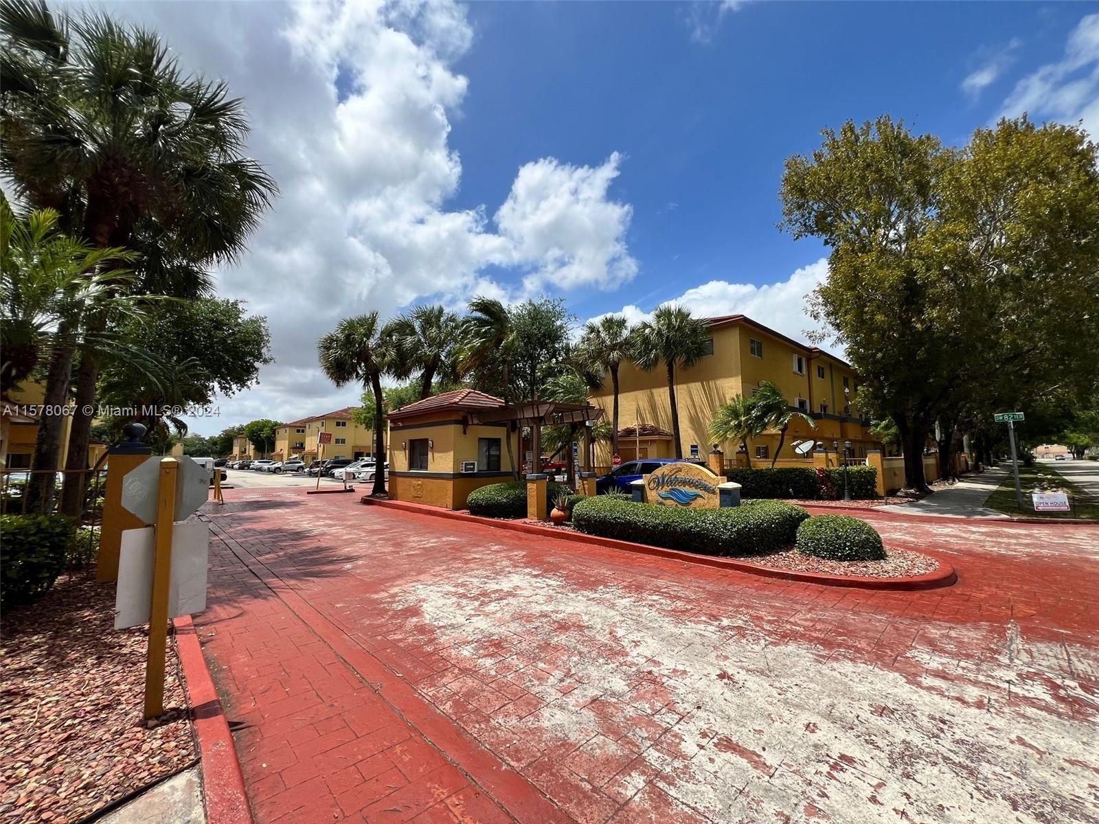 a front view of a house with a yard and pathway