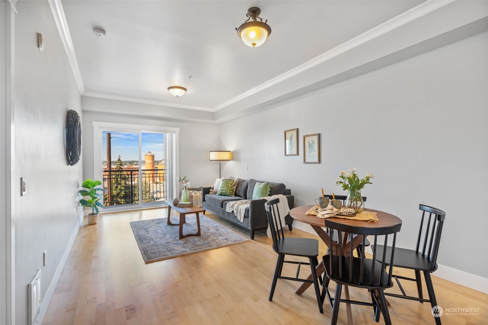 a view of a dining room with furniture and chandelier