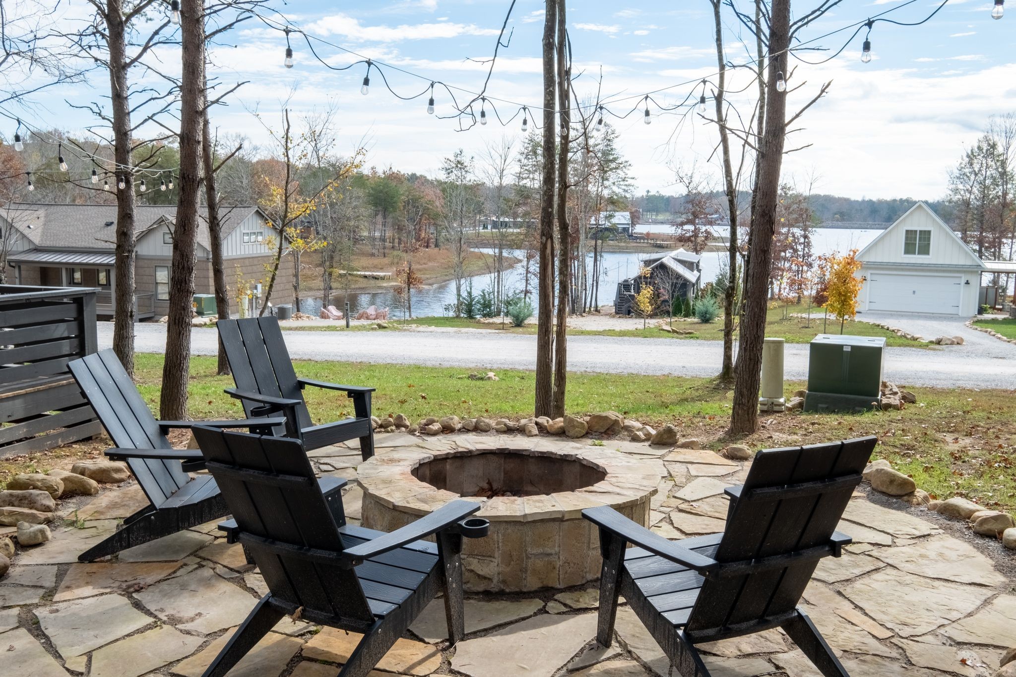 a view of a patio with a table chairs and a backyard