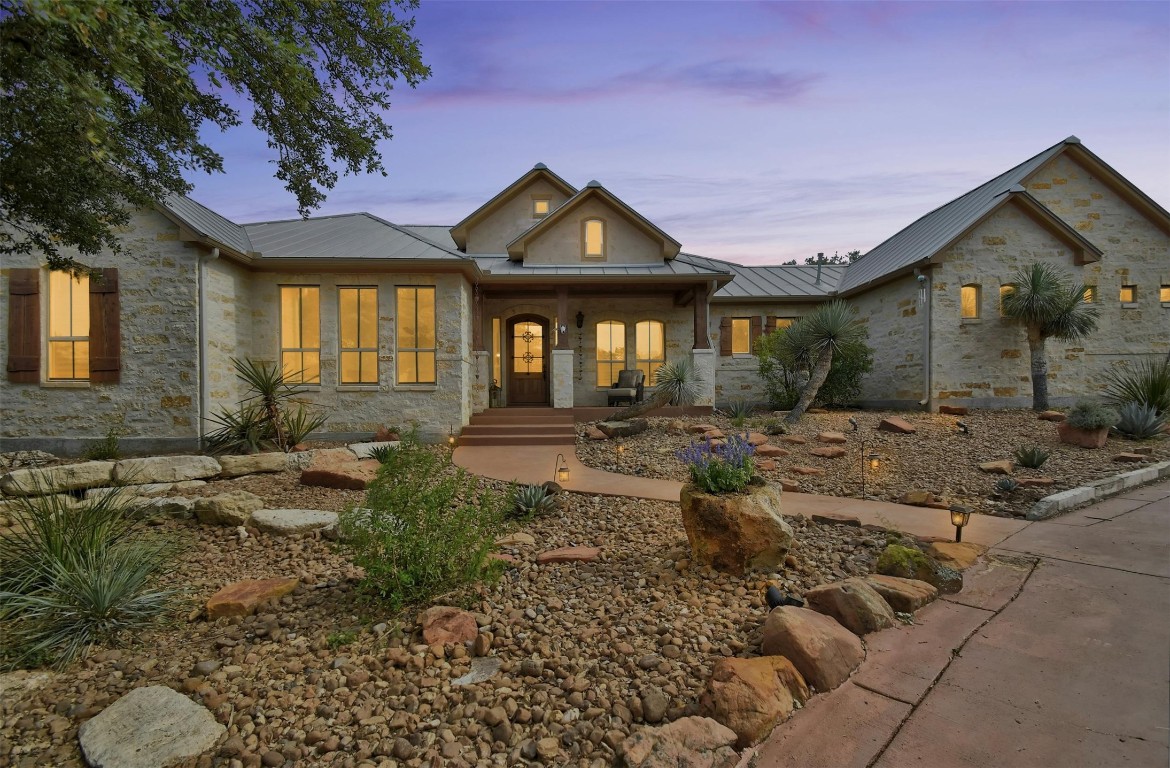 a front view of a house with garden