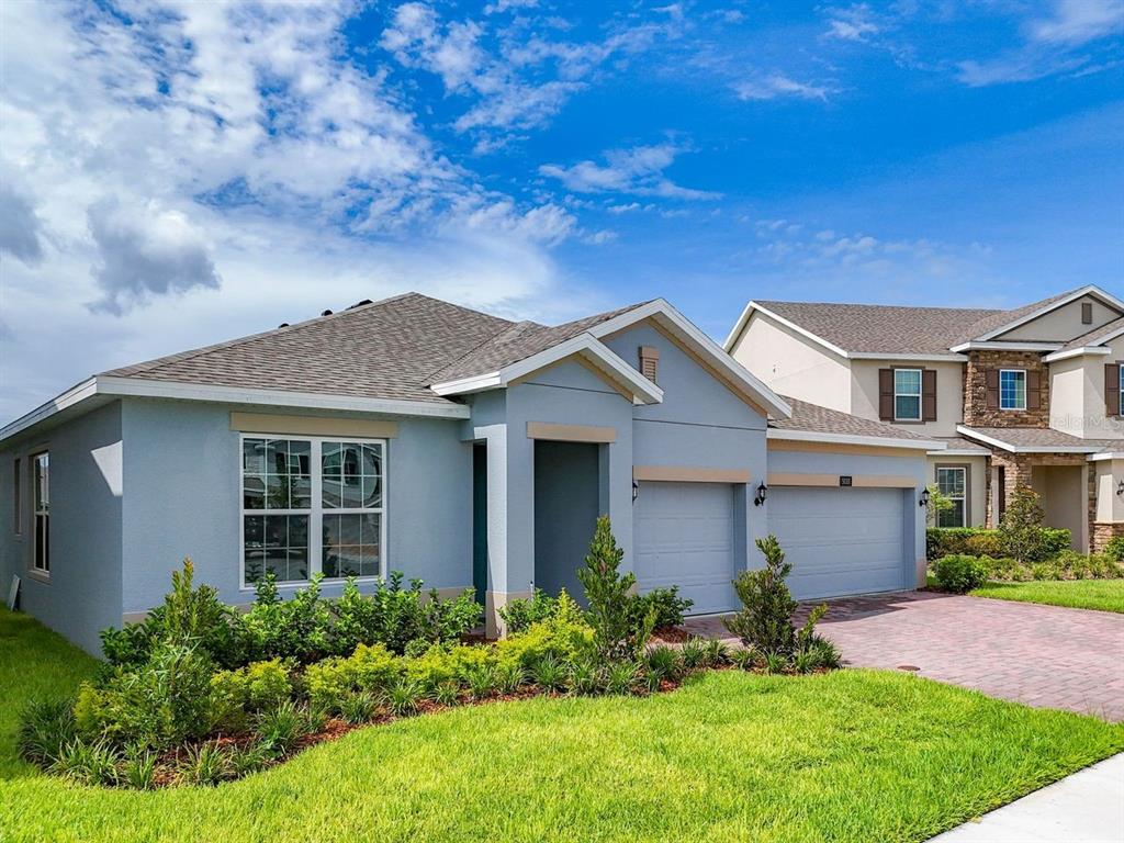 front view of a house with a yard