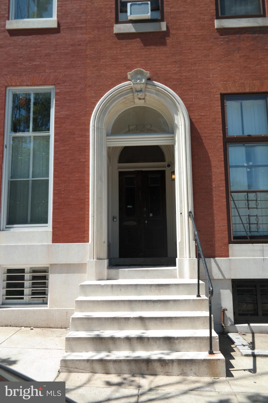 a front view of a house with a large windows