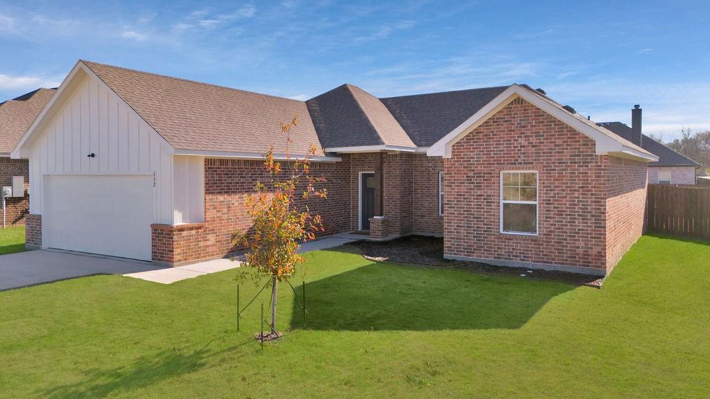 a view of house with backyard