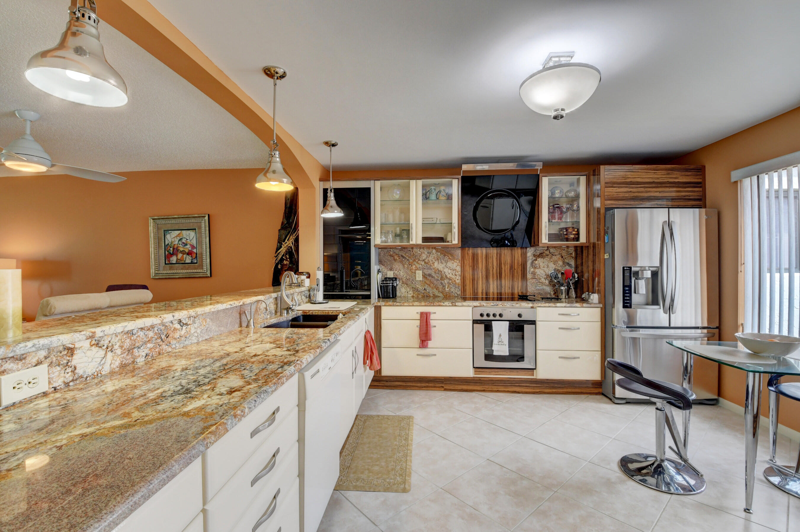 a kitchen with stainless steel appliances granite countertop a sink and cabinets