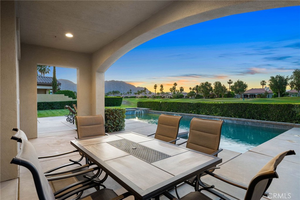 a view of an outdoor sitting area with furniture