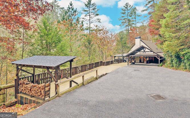 a view of house with a yard and sitting area