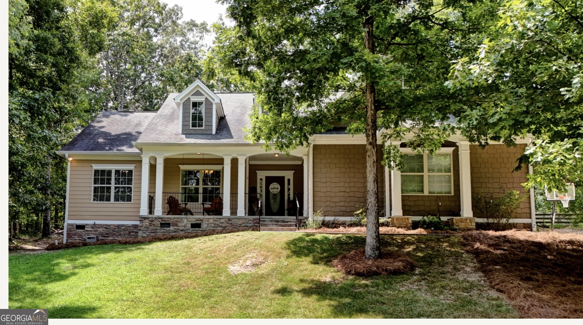 front view of a house with a yard