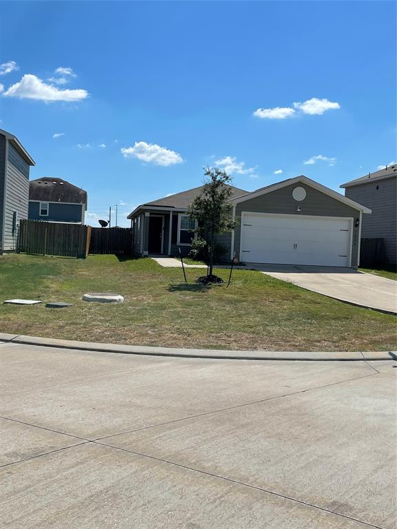 a view of a big house with a big yard