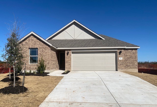 a front view of house with garage