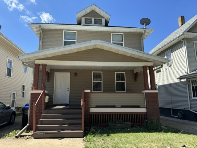 a front view of a house with wooden fence