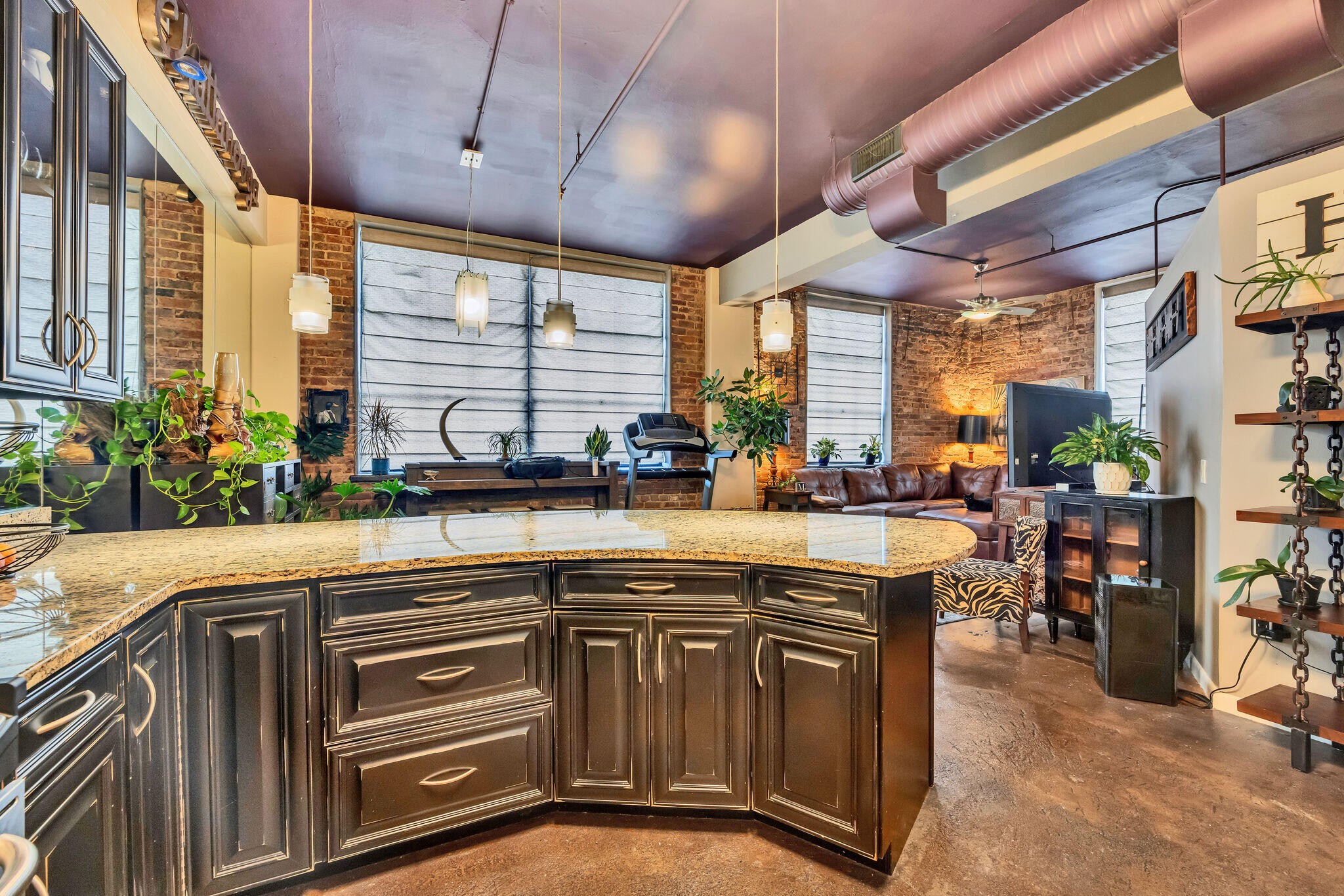 a kitchen with lots of counter top space and dining table