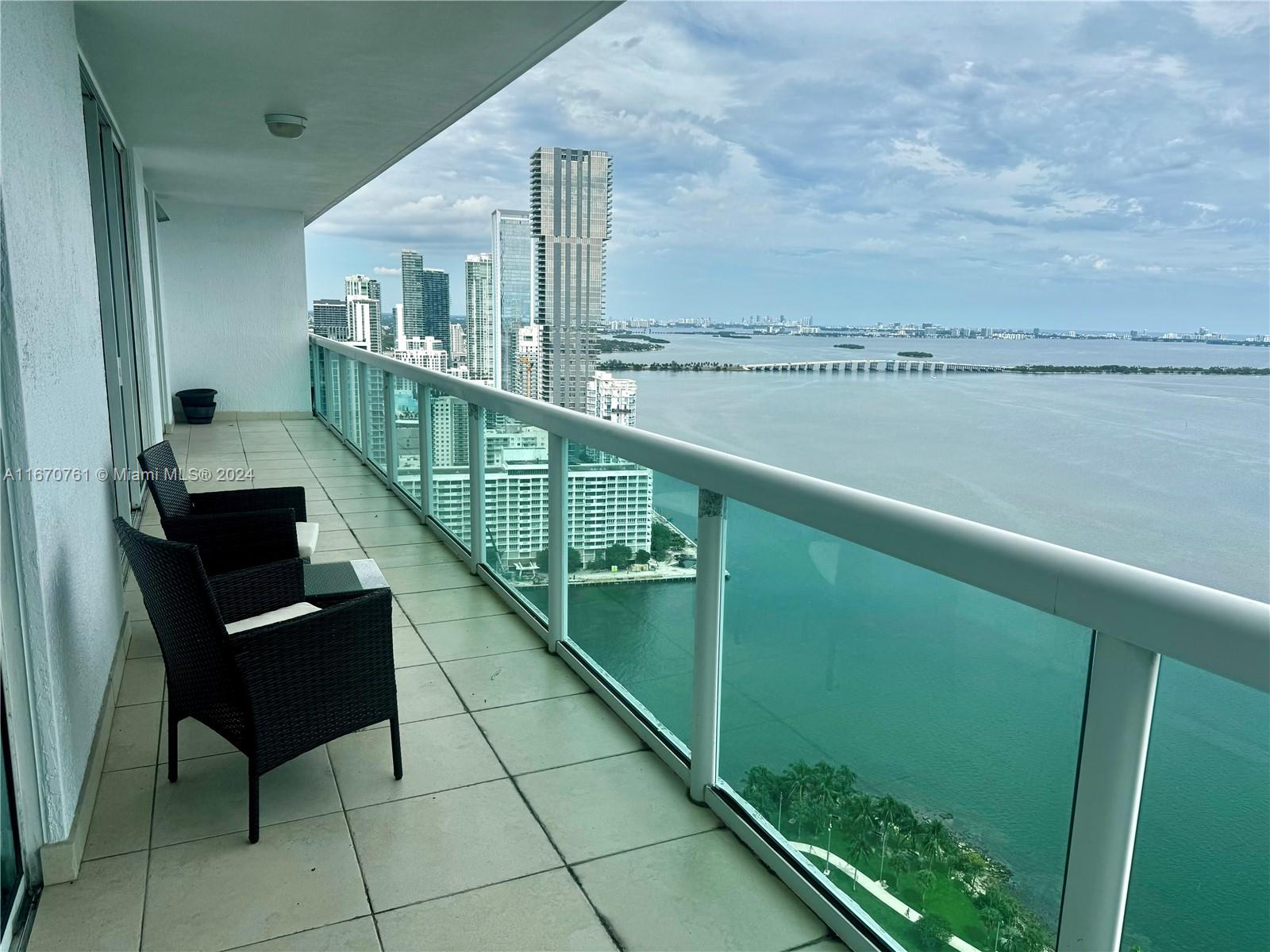 a view of a balcony with chairs