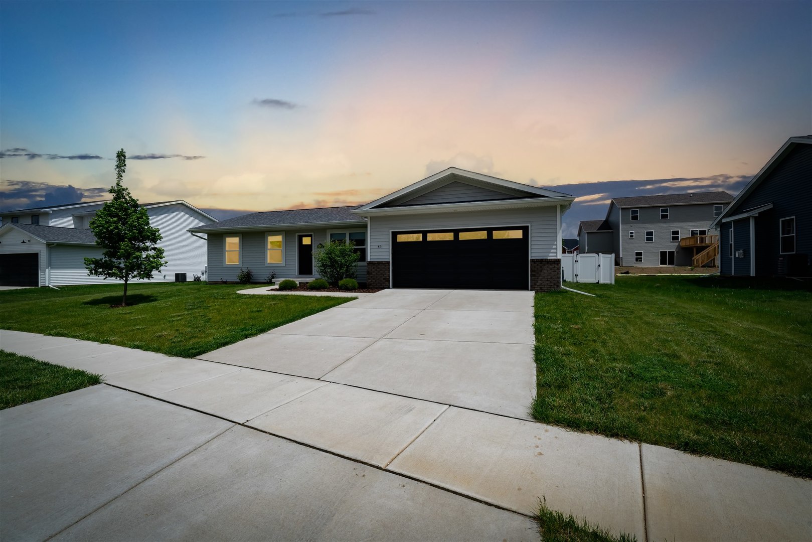 a front view of a house with a yard