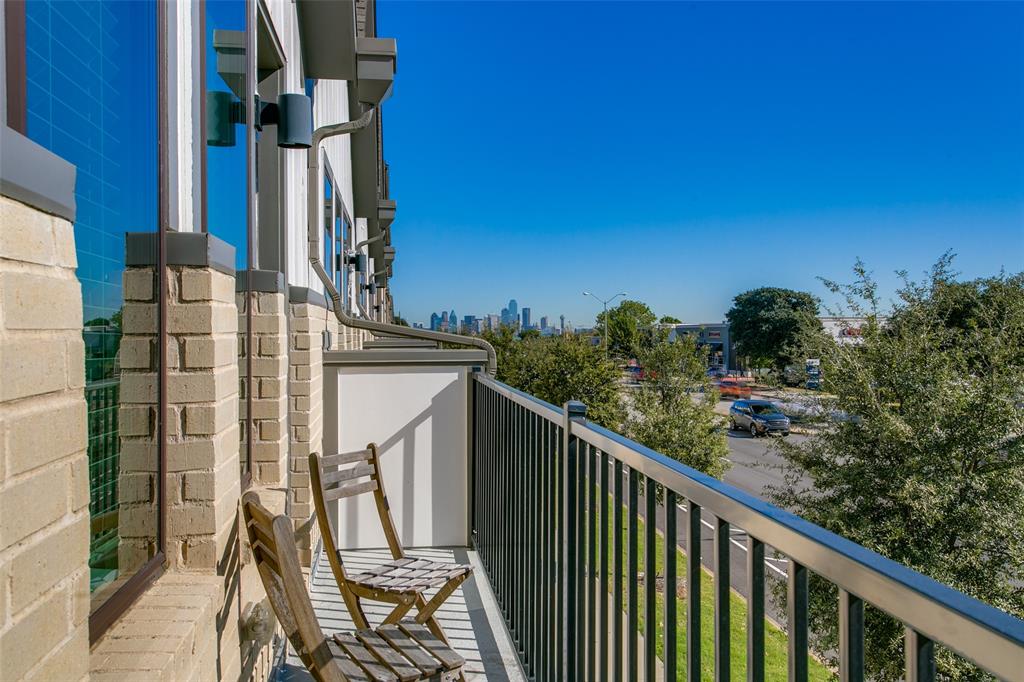 a view of balcony with furniture