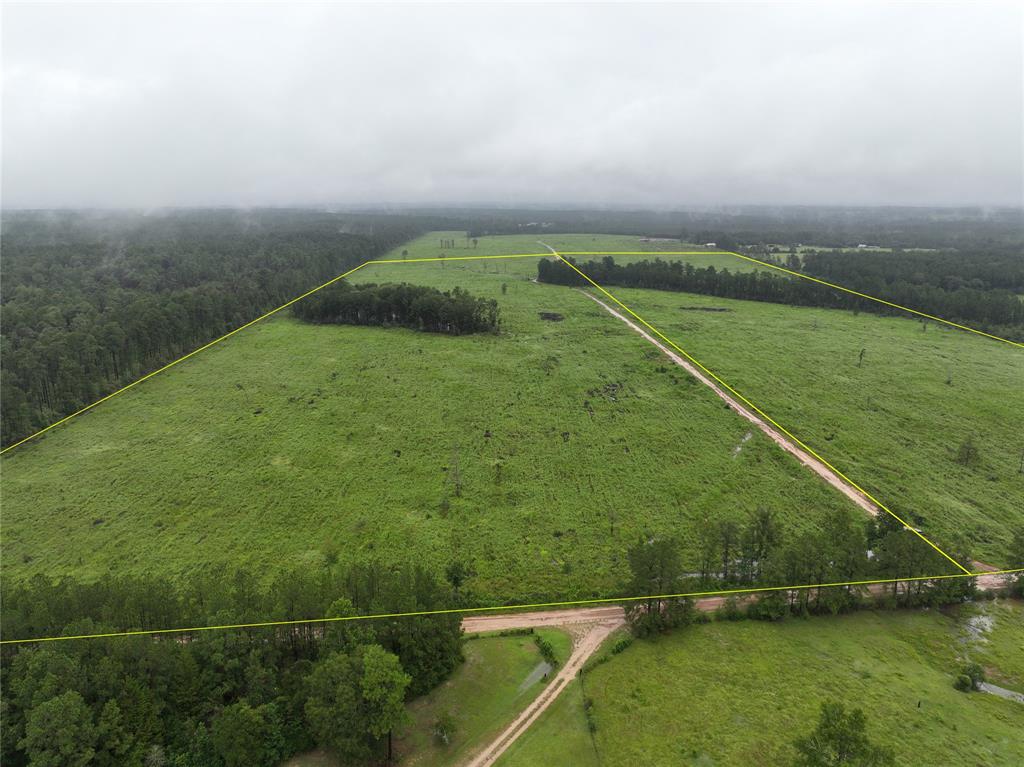 a view of a field with an outdoor space