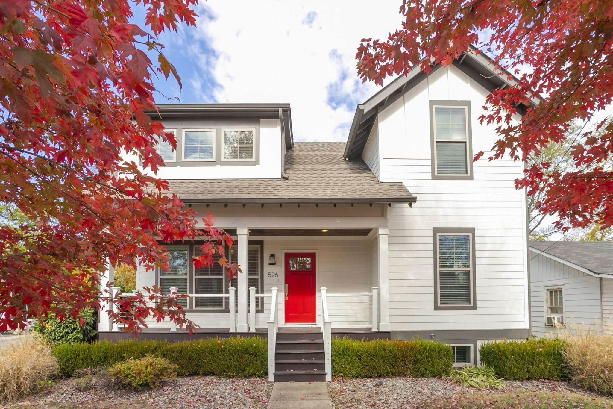 a front view of a house with garden