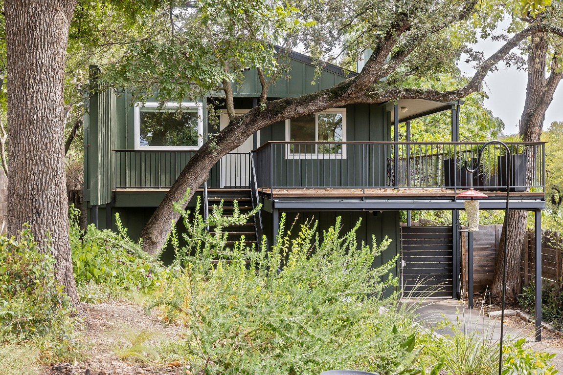 a balcony with trees in front of it