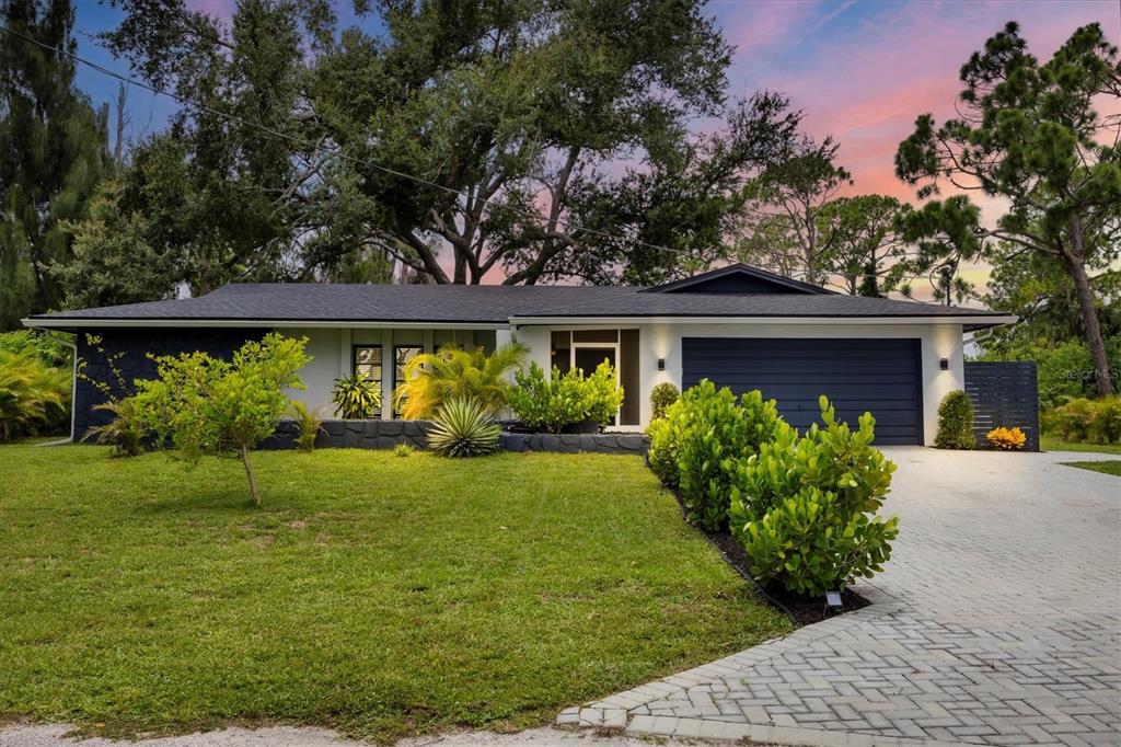 a front view of a house with garden