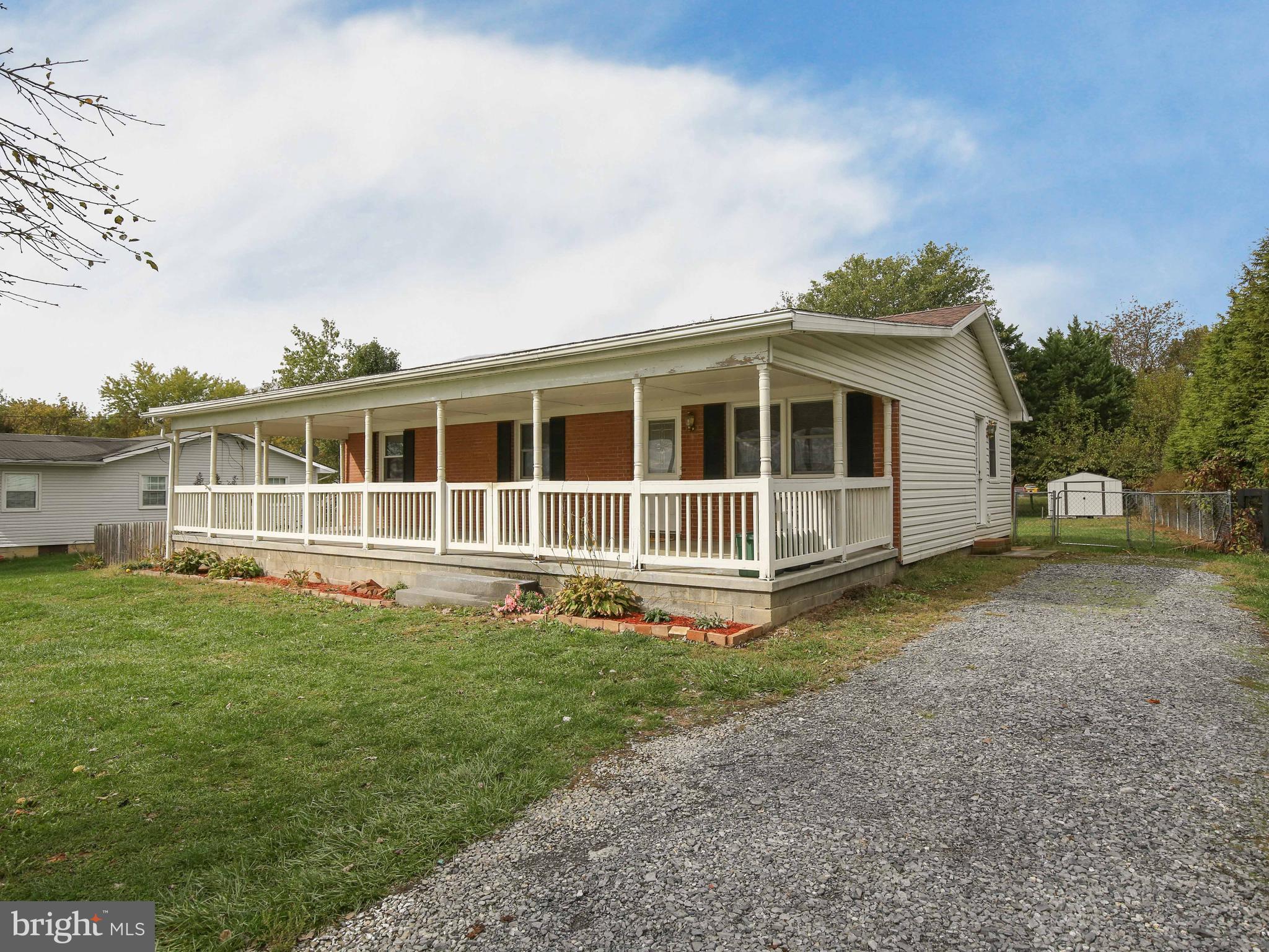 a view of front of house with a yard