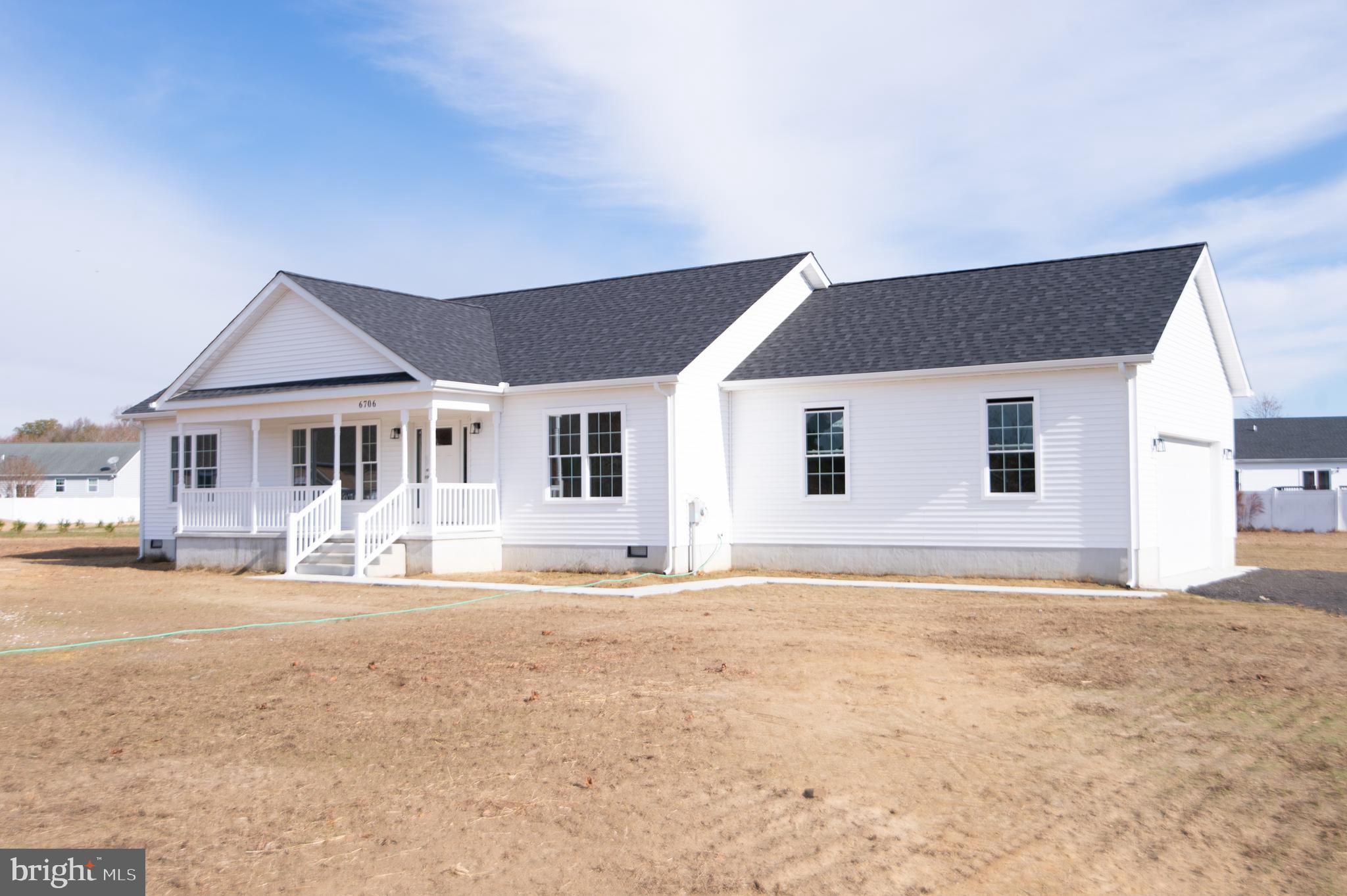 a front view of a house with a outdoor space