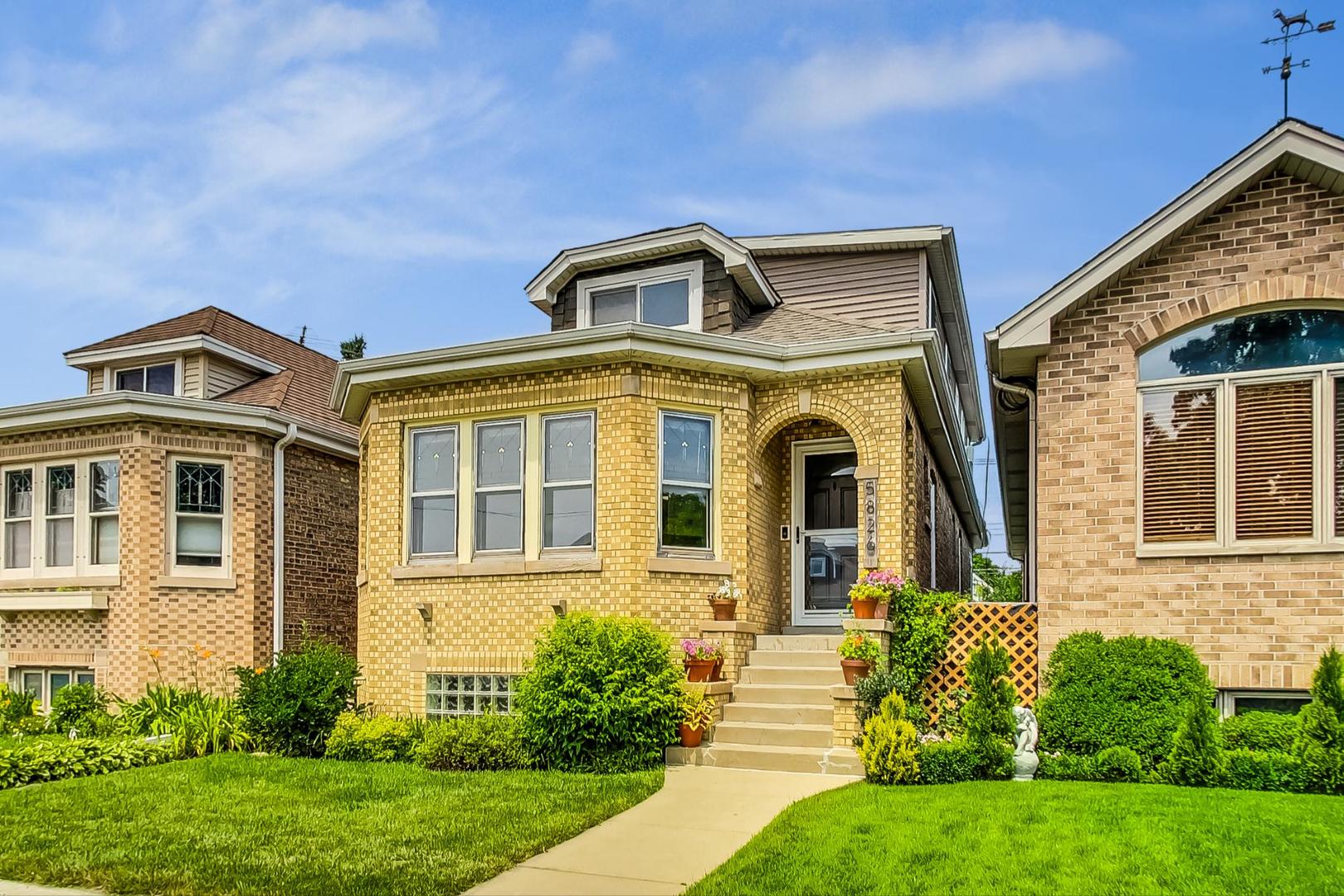 front view of a house with a yard